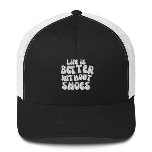 Black and white cap with 'Life is Better Without Shoes' text on a white background